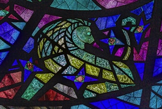 Detailed adult coloring page featuring a majestic lion surrounded by intricate floral patterns.