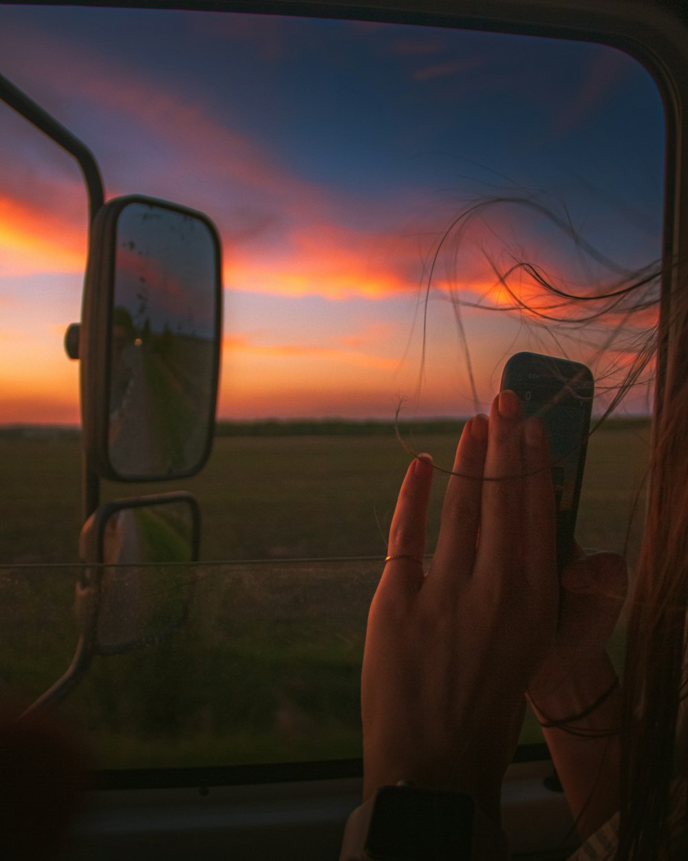 person holding black framed eyeglasses