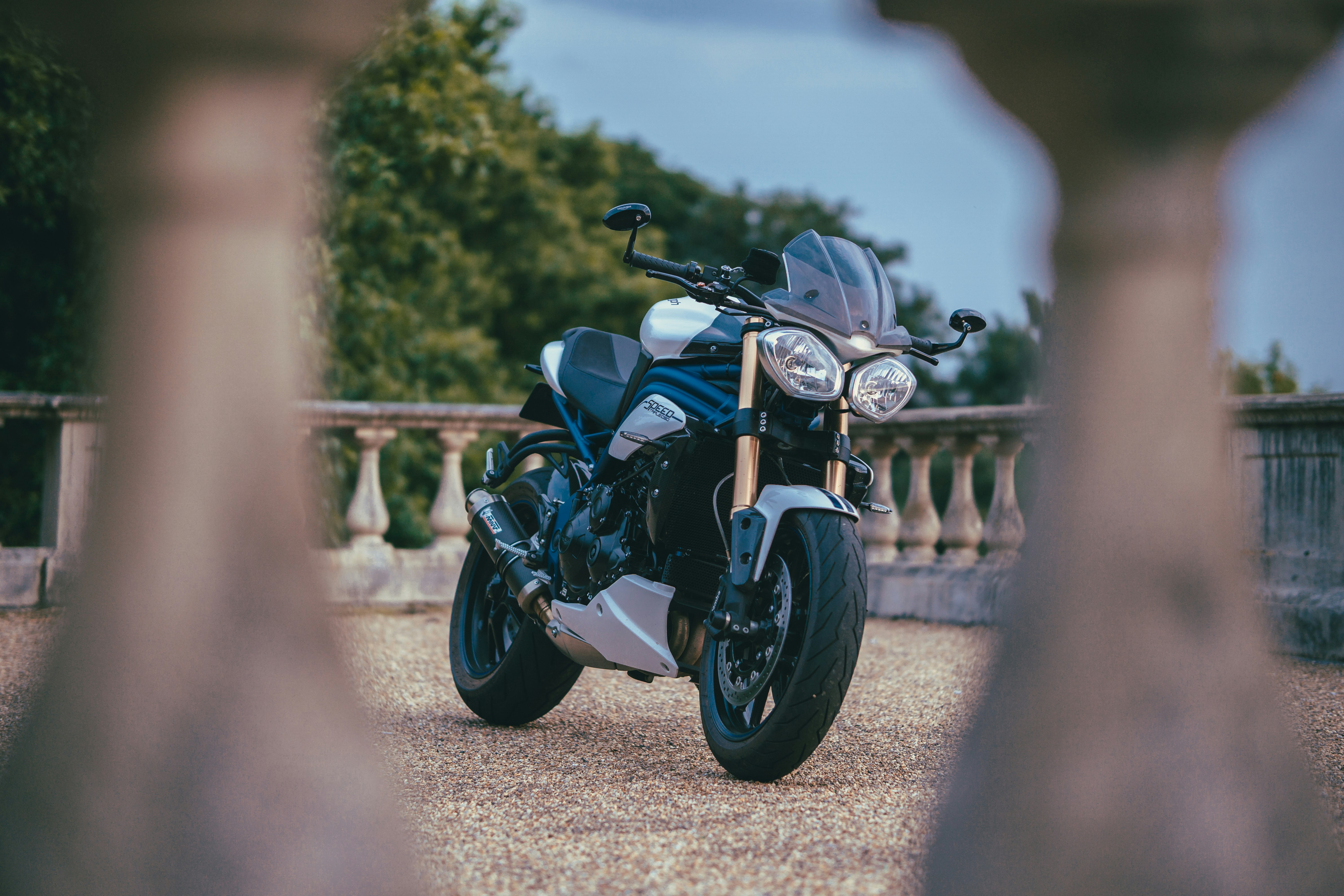 blue and black motorcycle on road during daytime