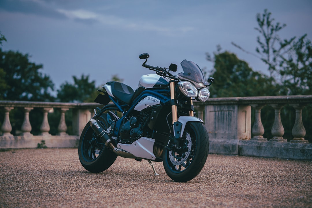 black and gray motorcycle on brown field during daytime