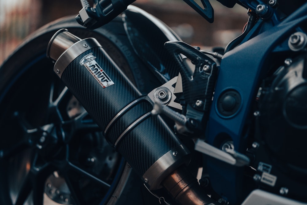 blue and black motorcycle in close up photography