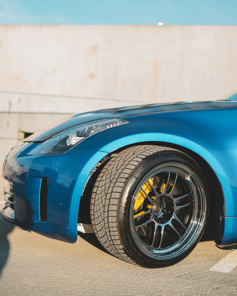 blue ferrari car in a garage