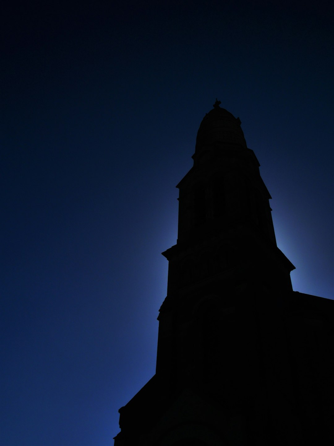 silhouette of tower during daytime