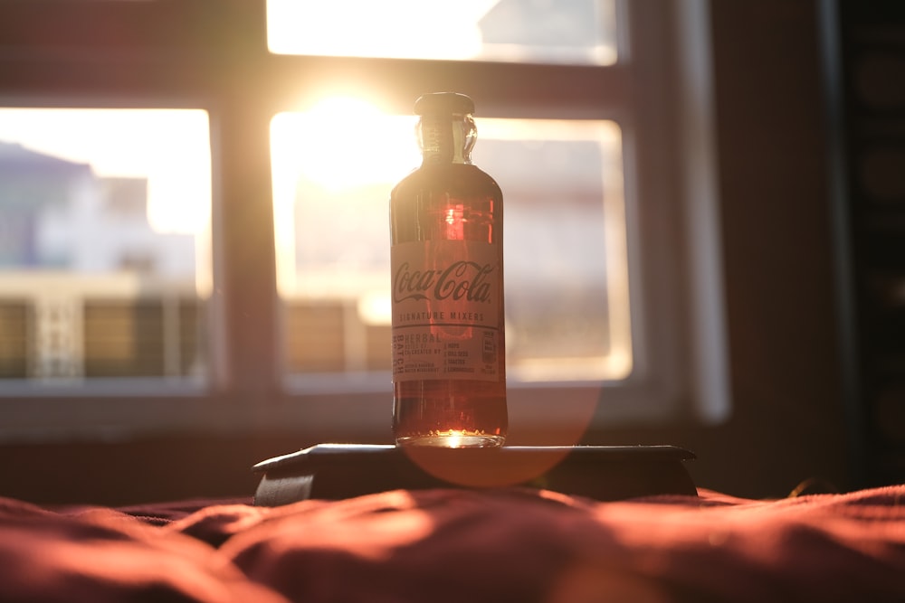 brown glass bottle on table