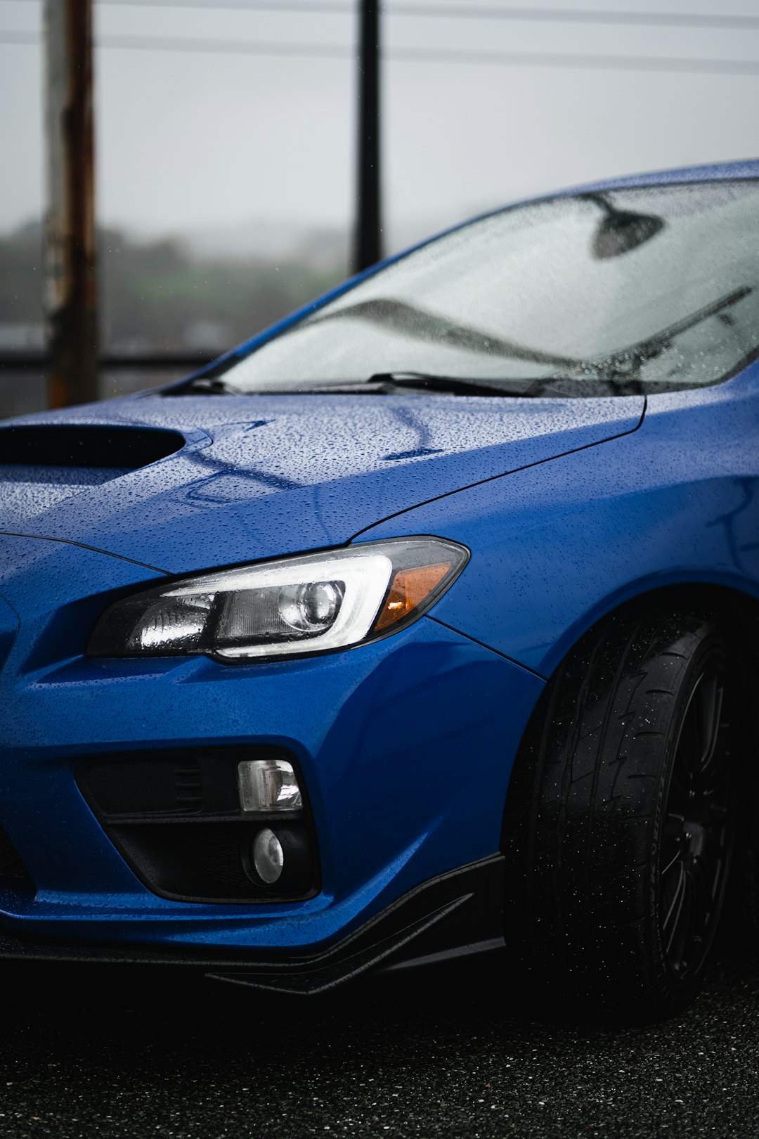 blue bmw car on road during daytime