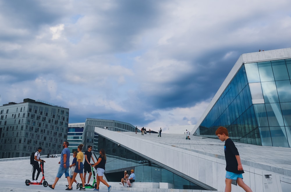 people walking on white concrete building during daytime