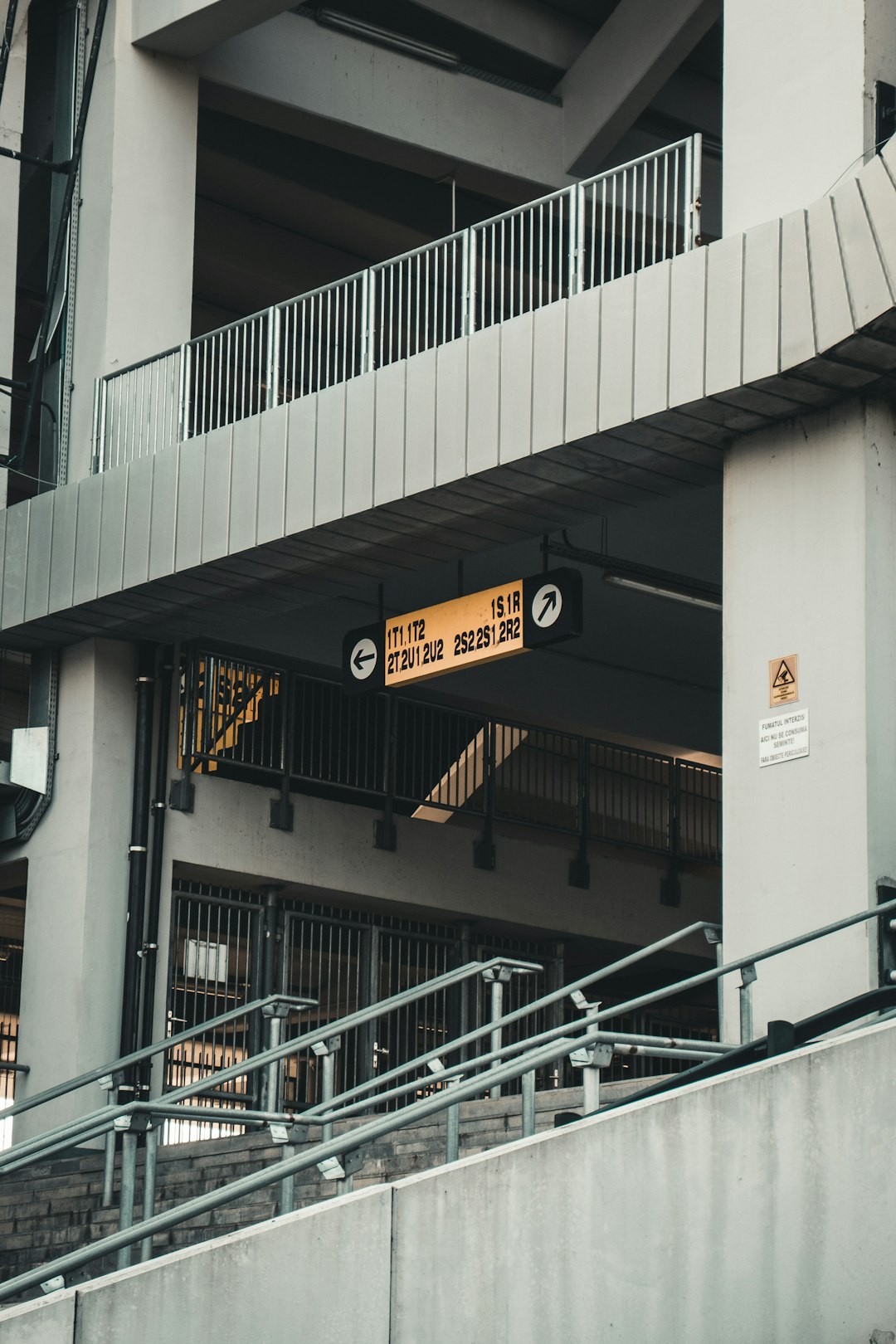 black and yellow sign on white concrete building