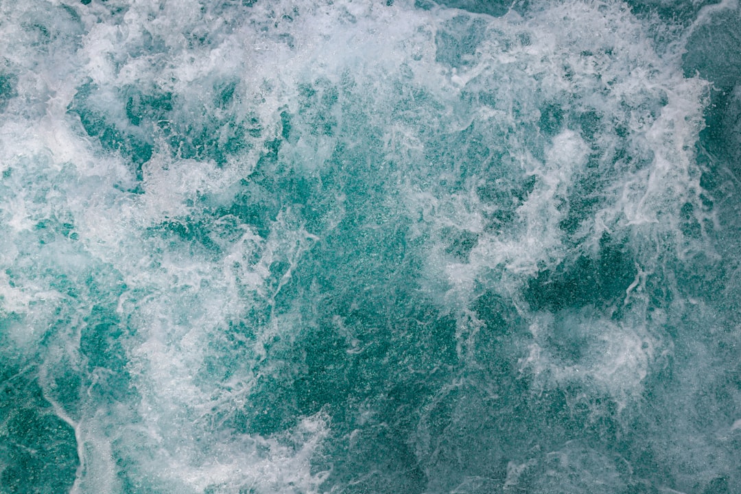 white and blue ocean waves