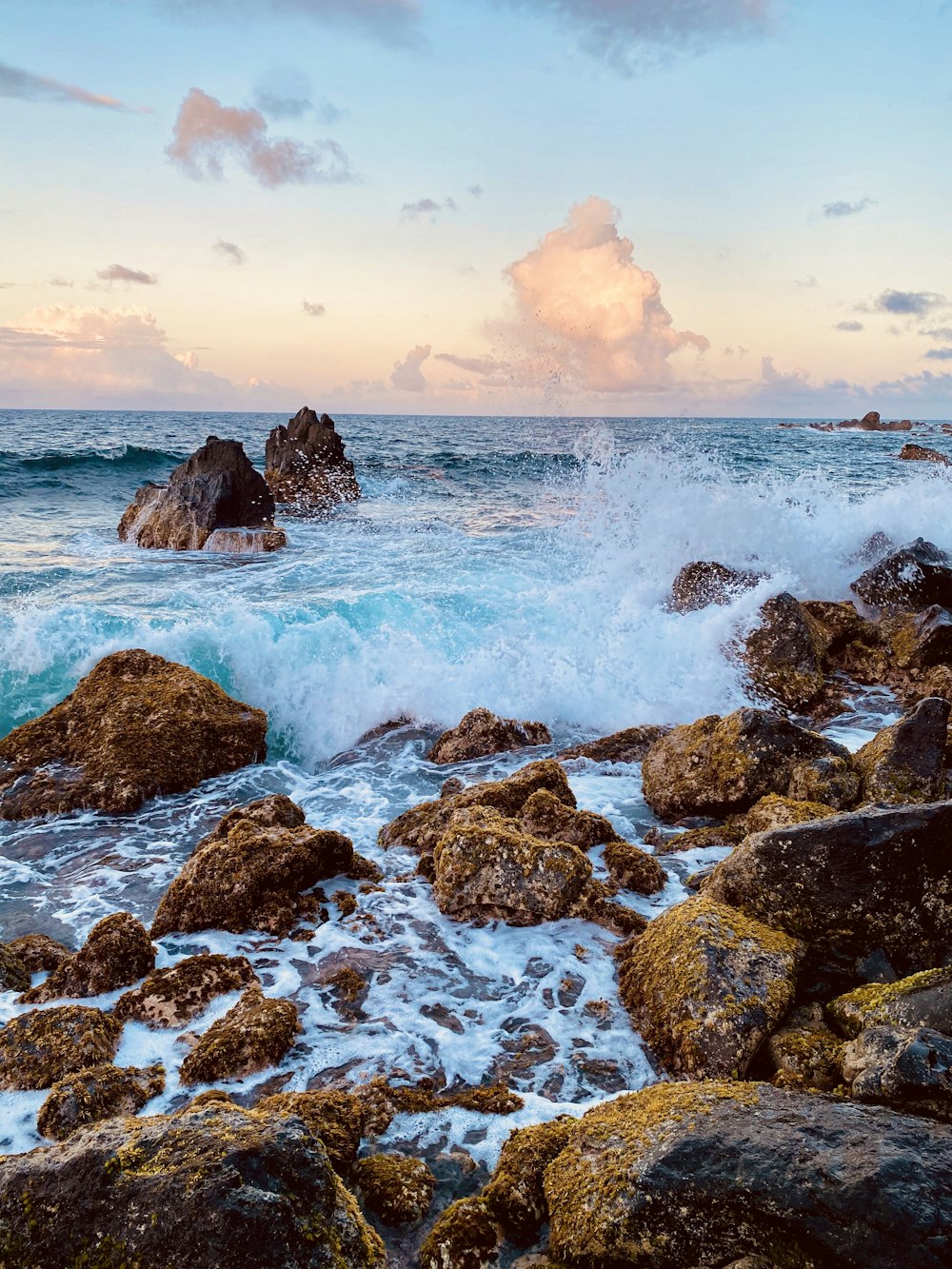 brown rock formation on sea during daytime