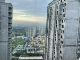 Modern furnished corporate apartment with city skyline in the background.