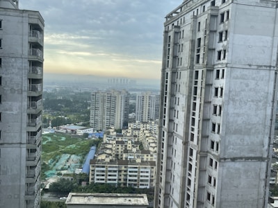 Modern city apartment overlooking skyscrapers and busy streets.