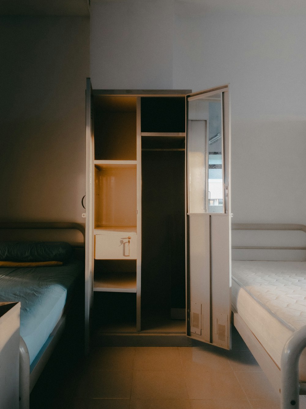 brown wooden cabinet with mirror