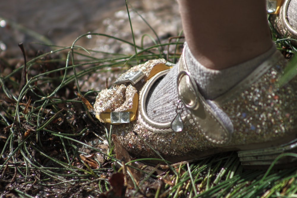 person wearing brown and black hiking shoes