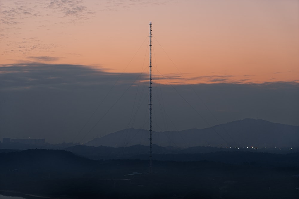 black and white tower on top of mountain during daytime