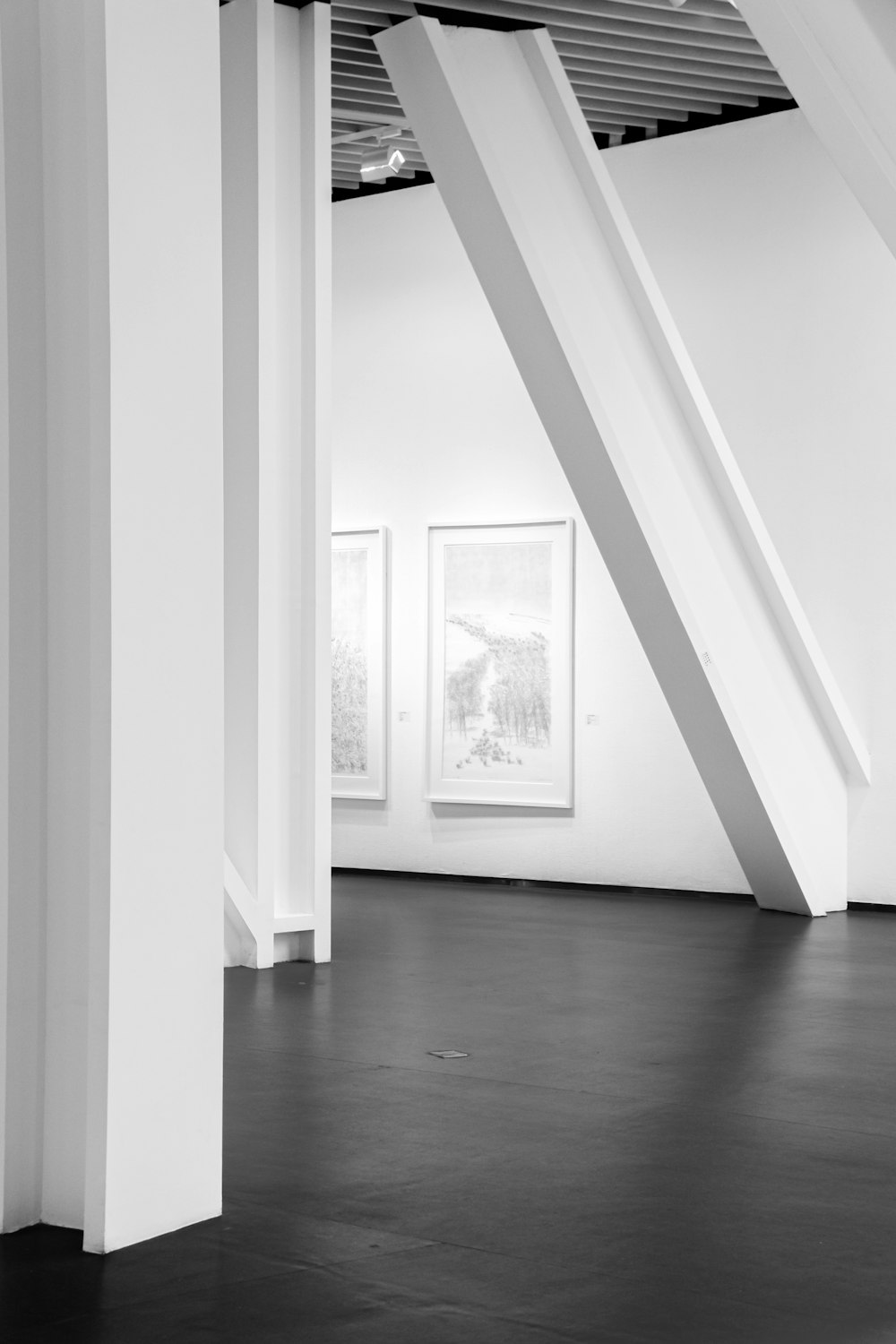 grayscale photo of white wooden framed glass window