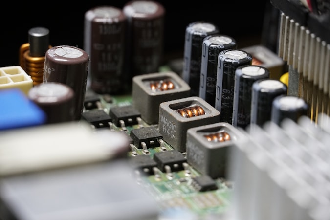 Green and black DDR memory stick isolated against a dark background showing chip modules