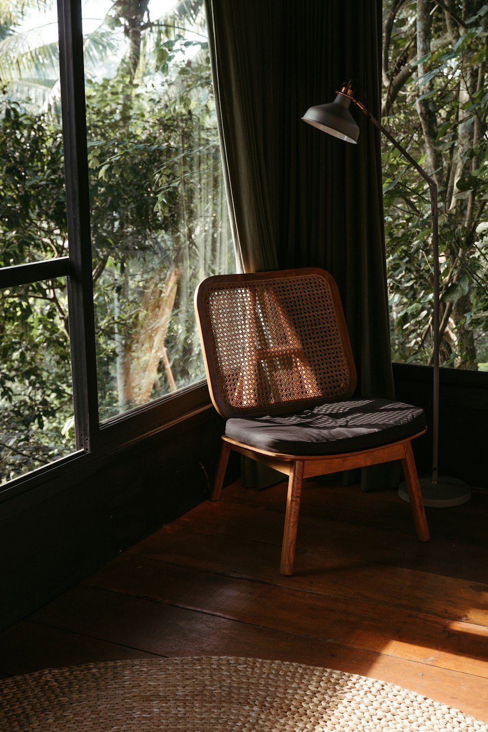 brown wooden chair near window