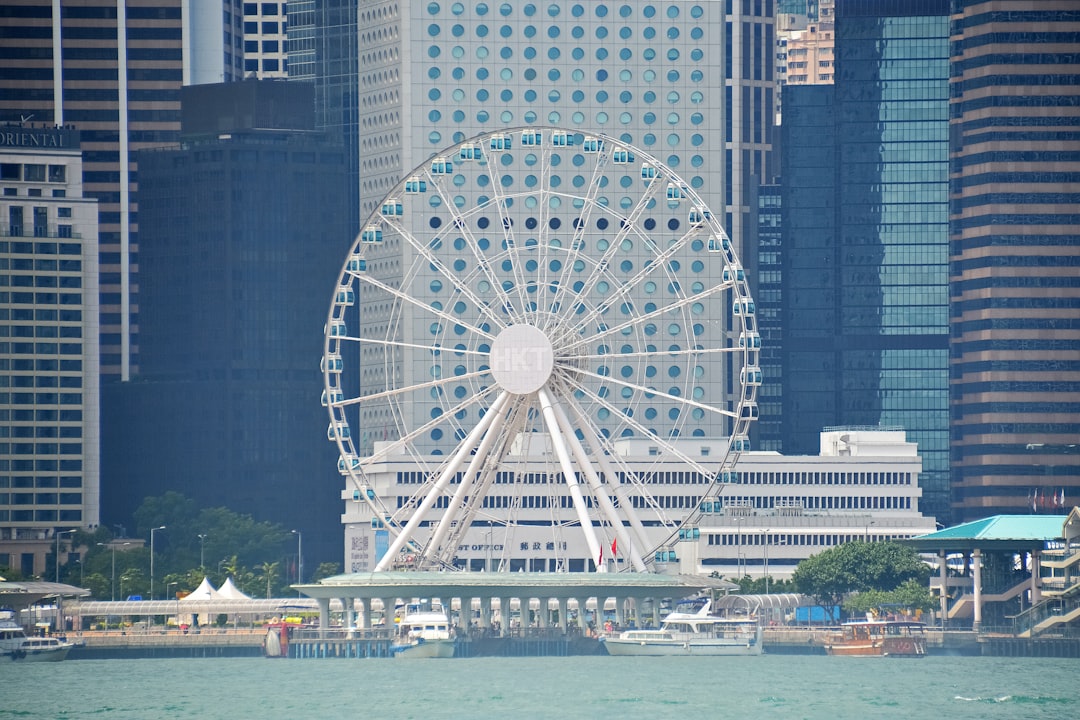 white ferris wheel near body of water during night time