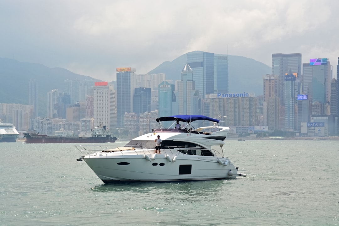 white and black yacht on sea during daytime