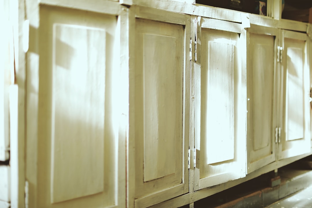 white wooden cabinet with mirror