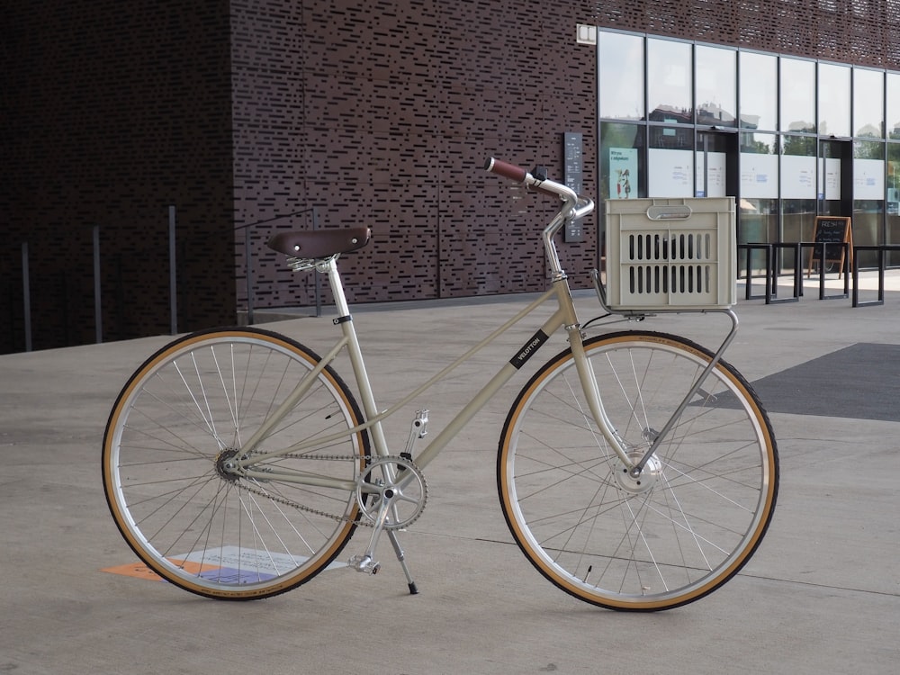 black city bike near brown brick wall