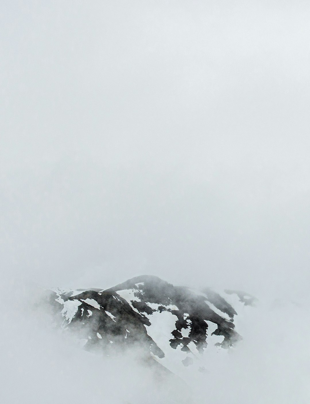 snow covered mountain during daytime