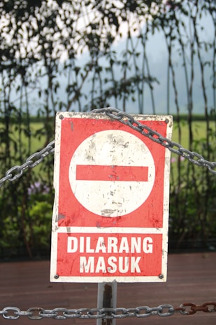 red and white no smoking sign