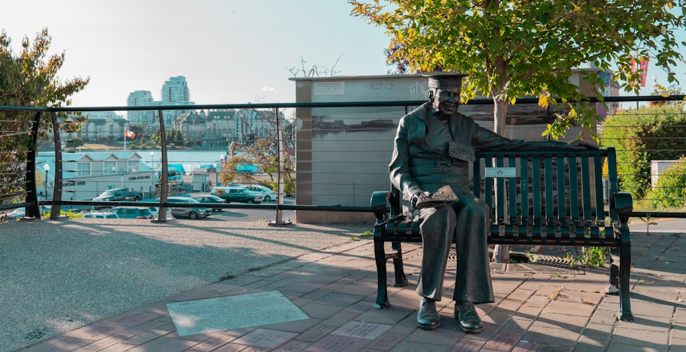 man in black jacket sitting on bench