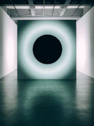Sleek black alarm system panel glowing softly in a dark room