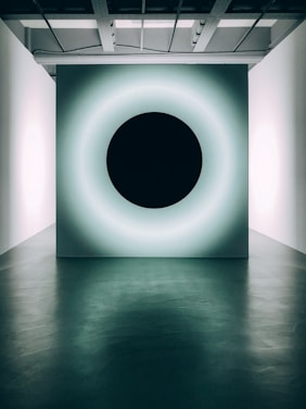 white round ceiling light turned on in a room