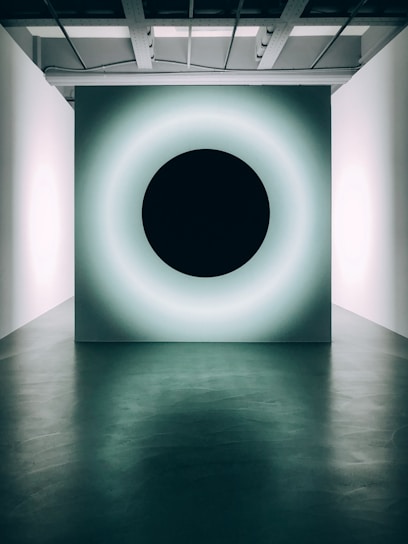 white round ceiling light turned on in a room