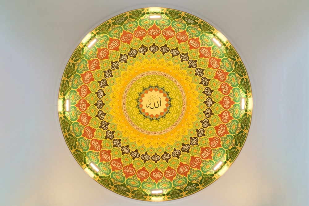 red green and yellow floral ceramic plate