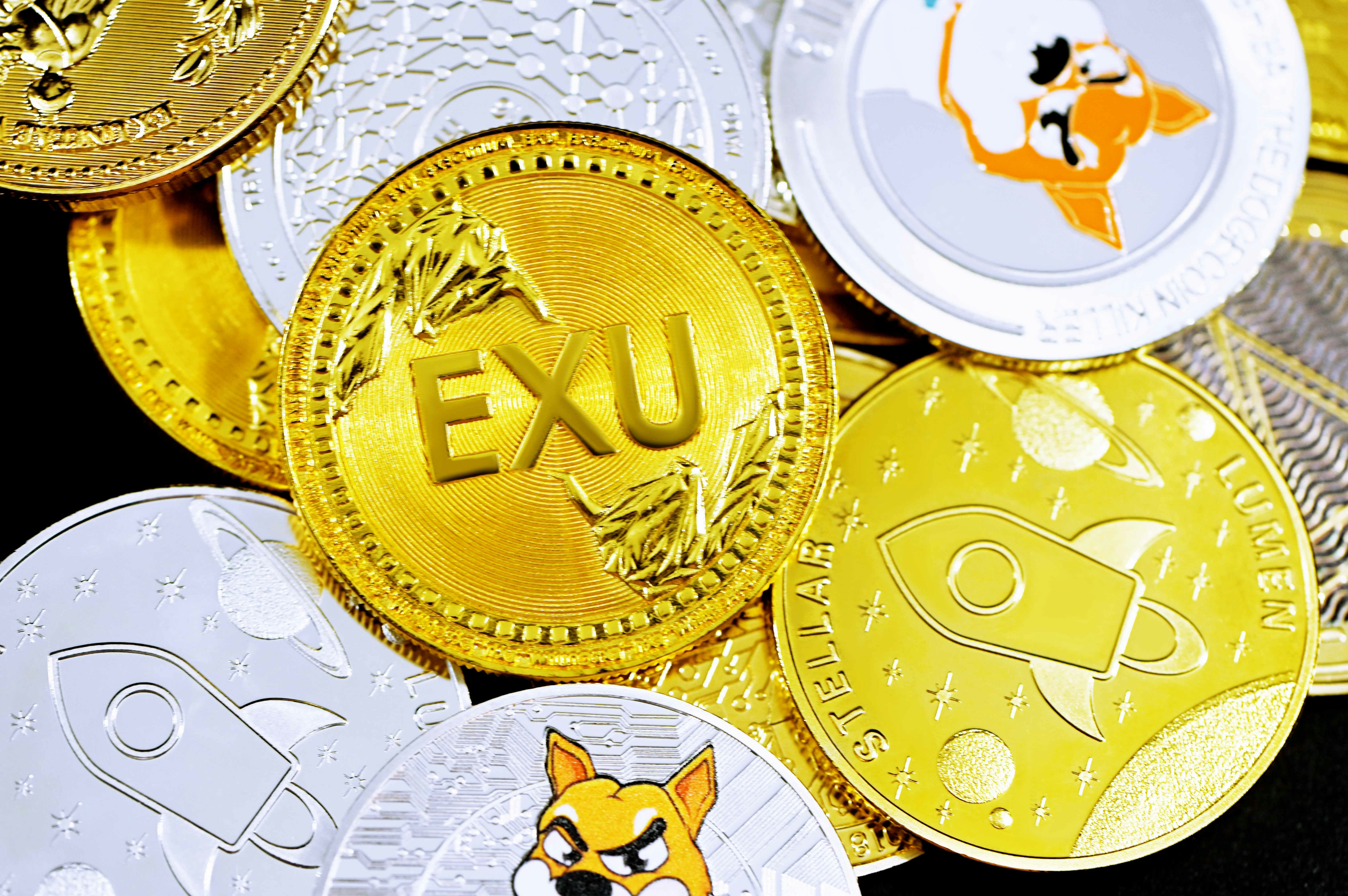 gold round coin on white surface