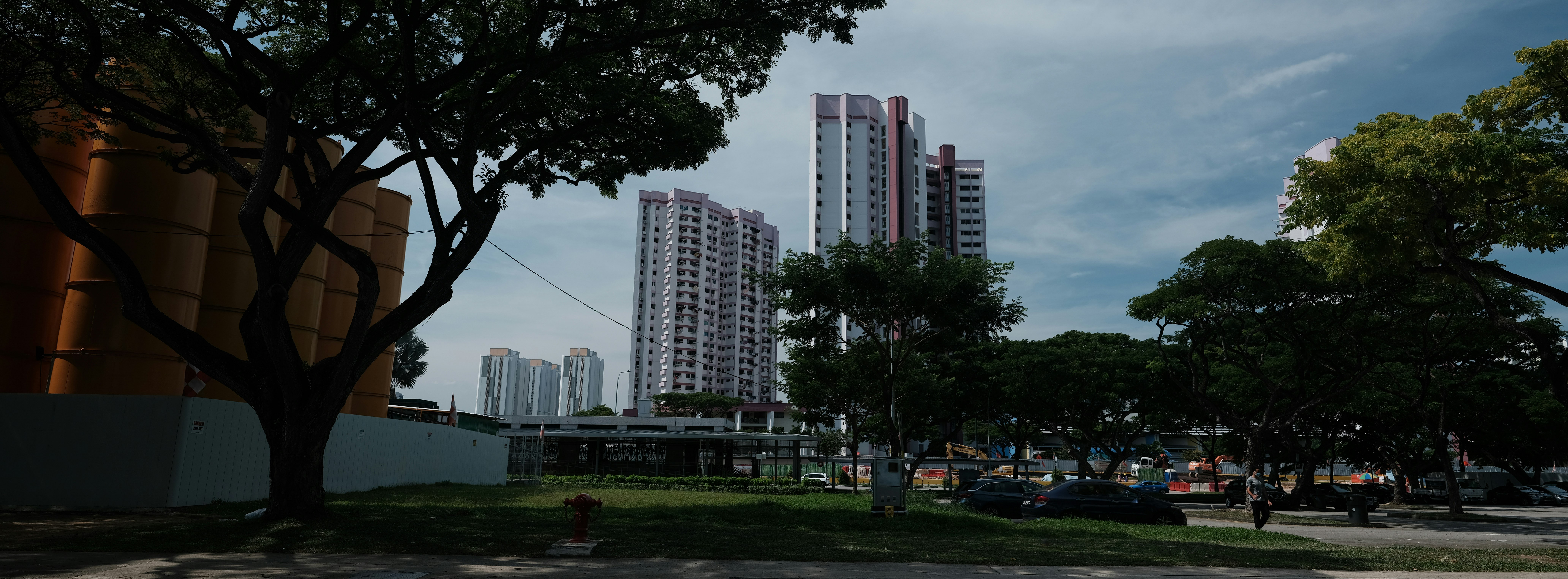 green grass field near high rise buildings during daytime