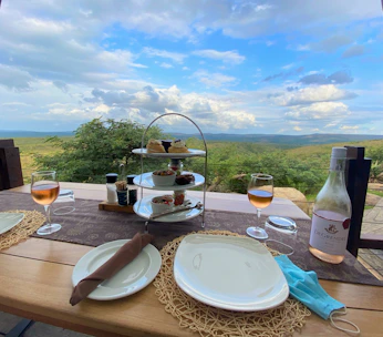 Elegant table setting with Mediterranean dishes served in a sunlit villa terrace.