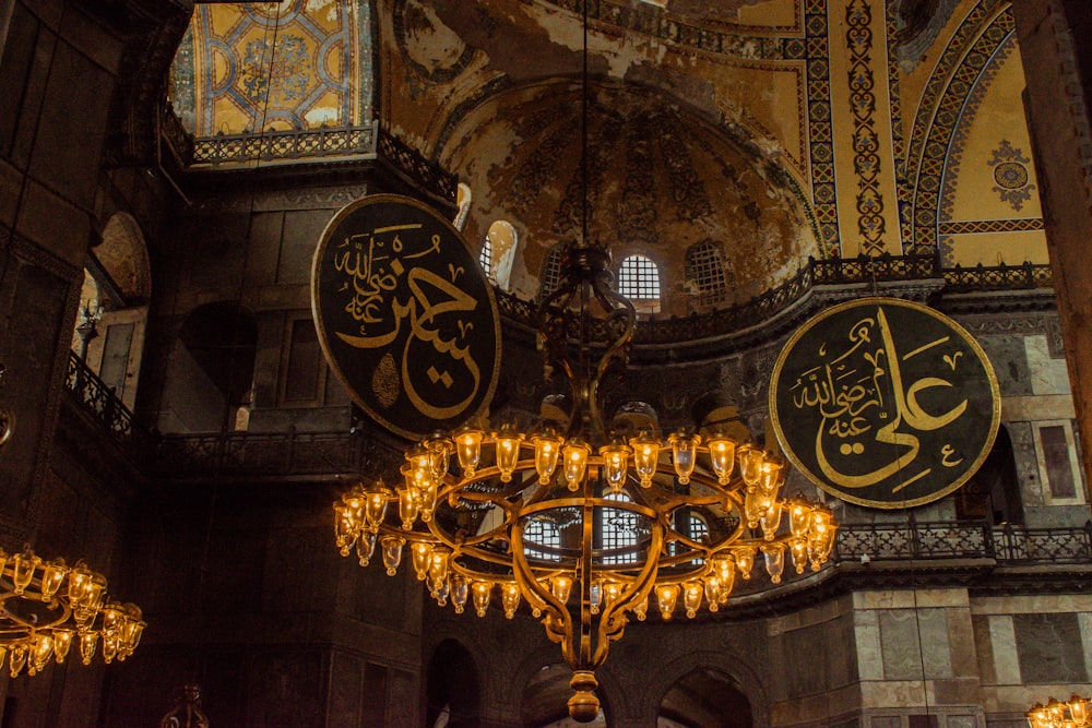 gold and black chandelier on ceiling