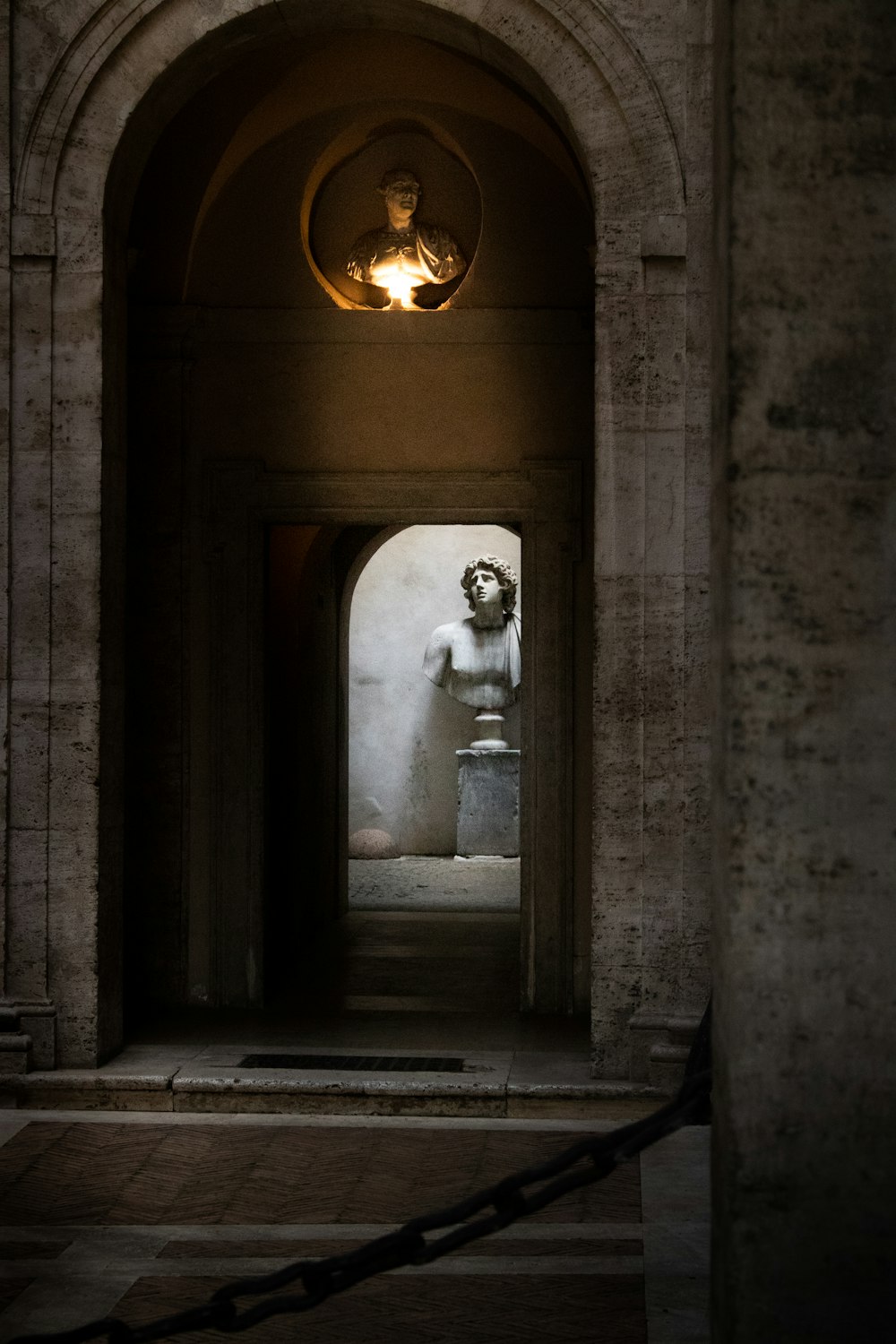 man in white shirt standing in front of door