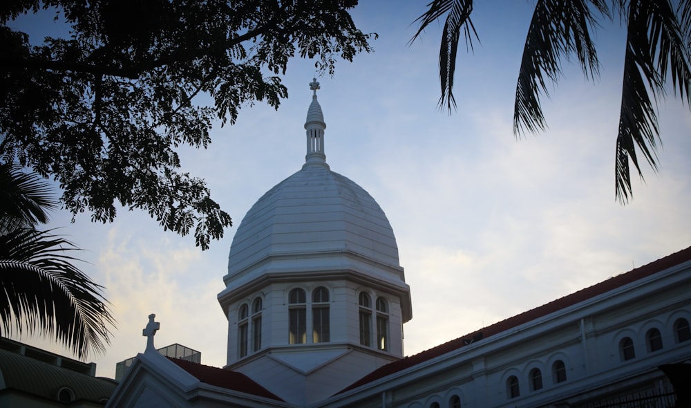 white dome building under white clouds during daytime