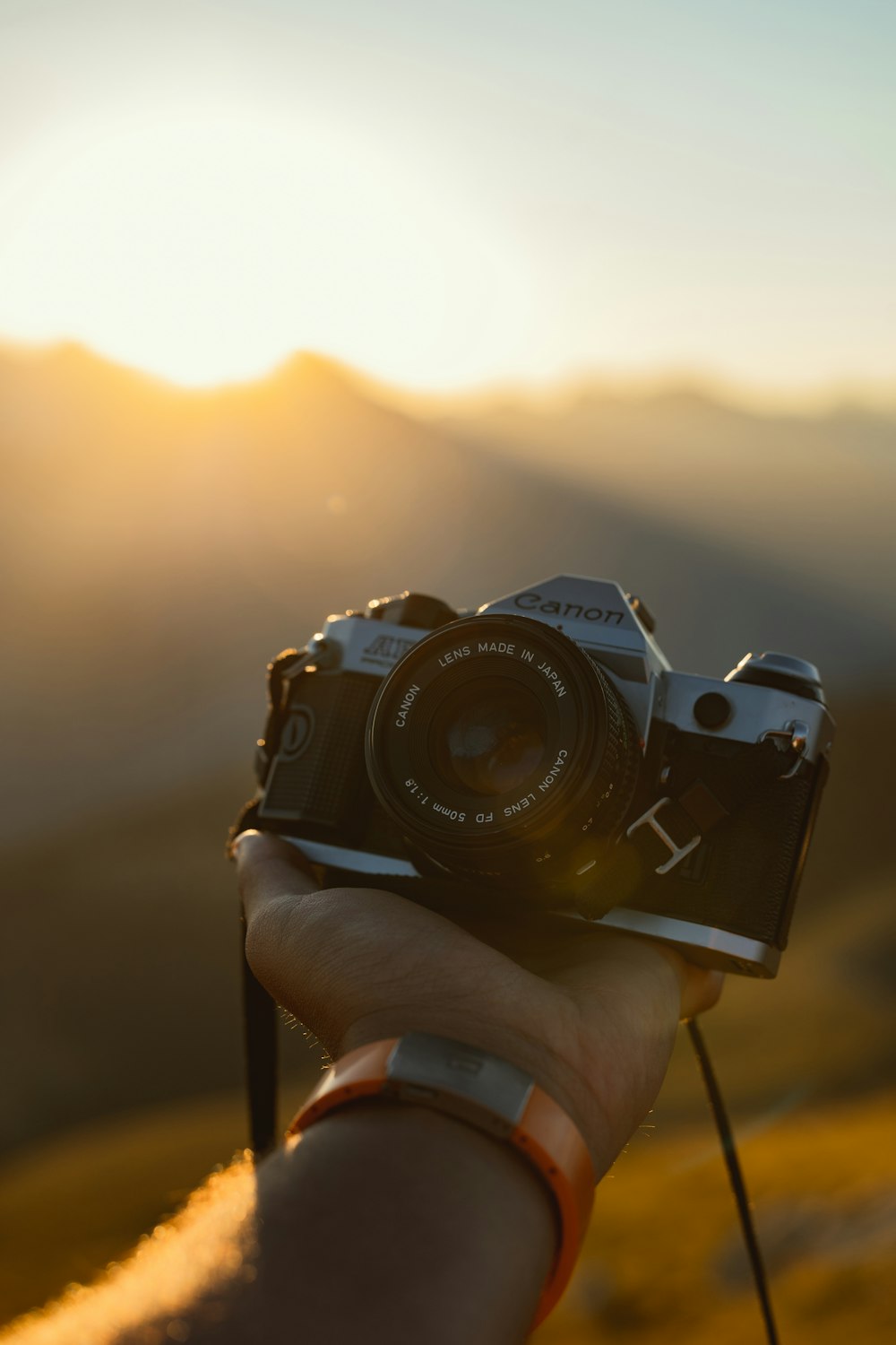 a person holding a camera in their hand