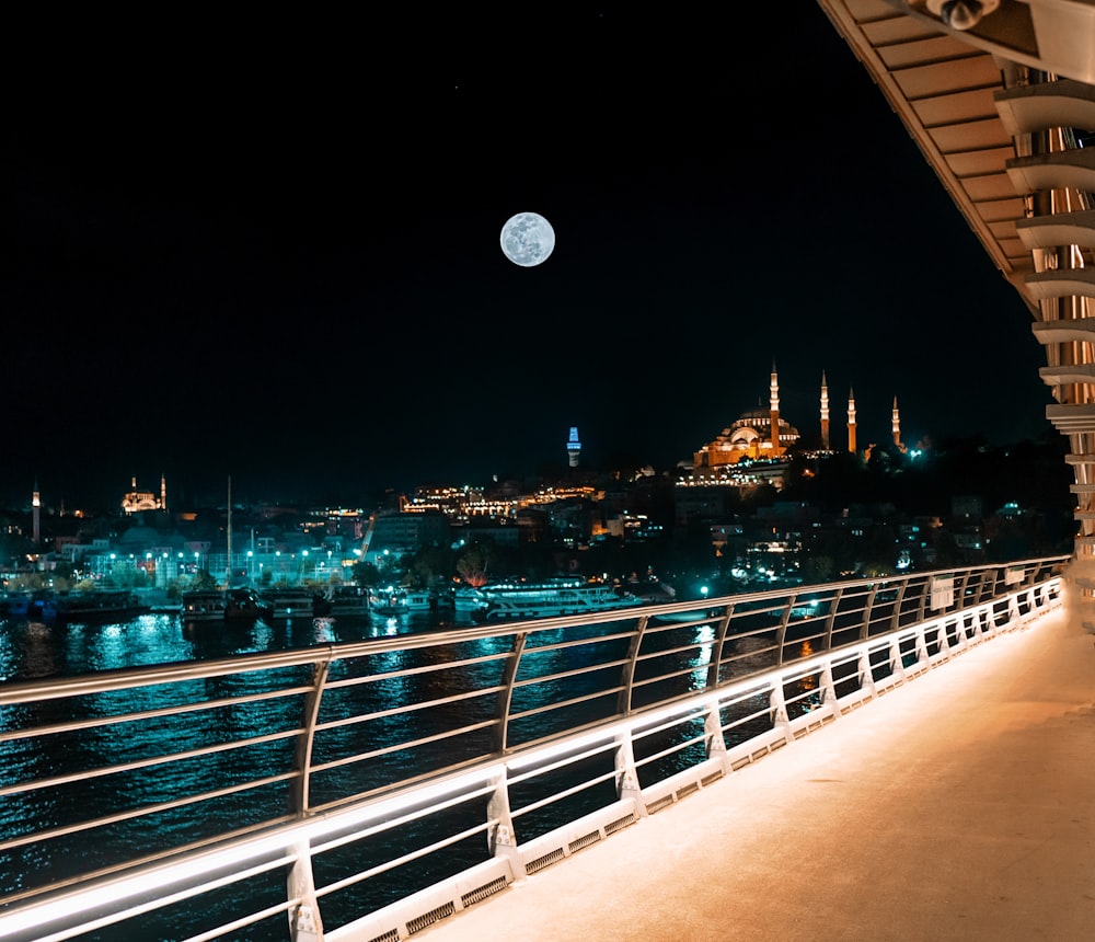 people walking on bridge during night time