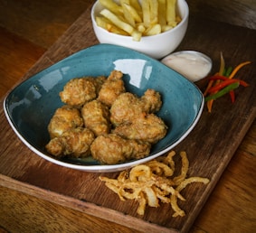 fried chicken on blue ceramic bowl
