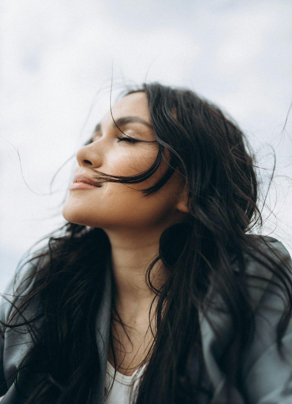 woman in black shirt wearing eyeglasses