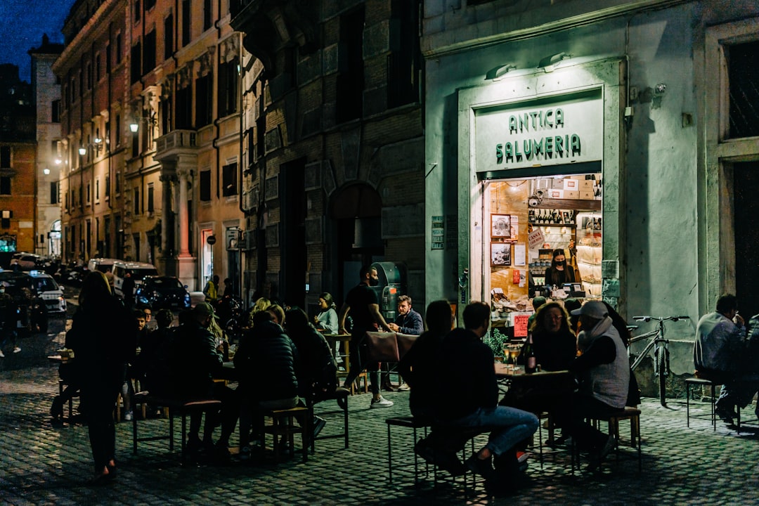 people sitting on chair near building during daytime