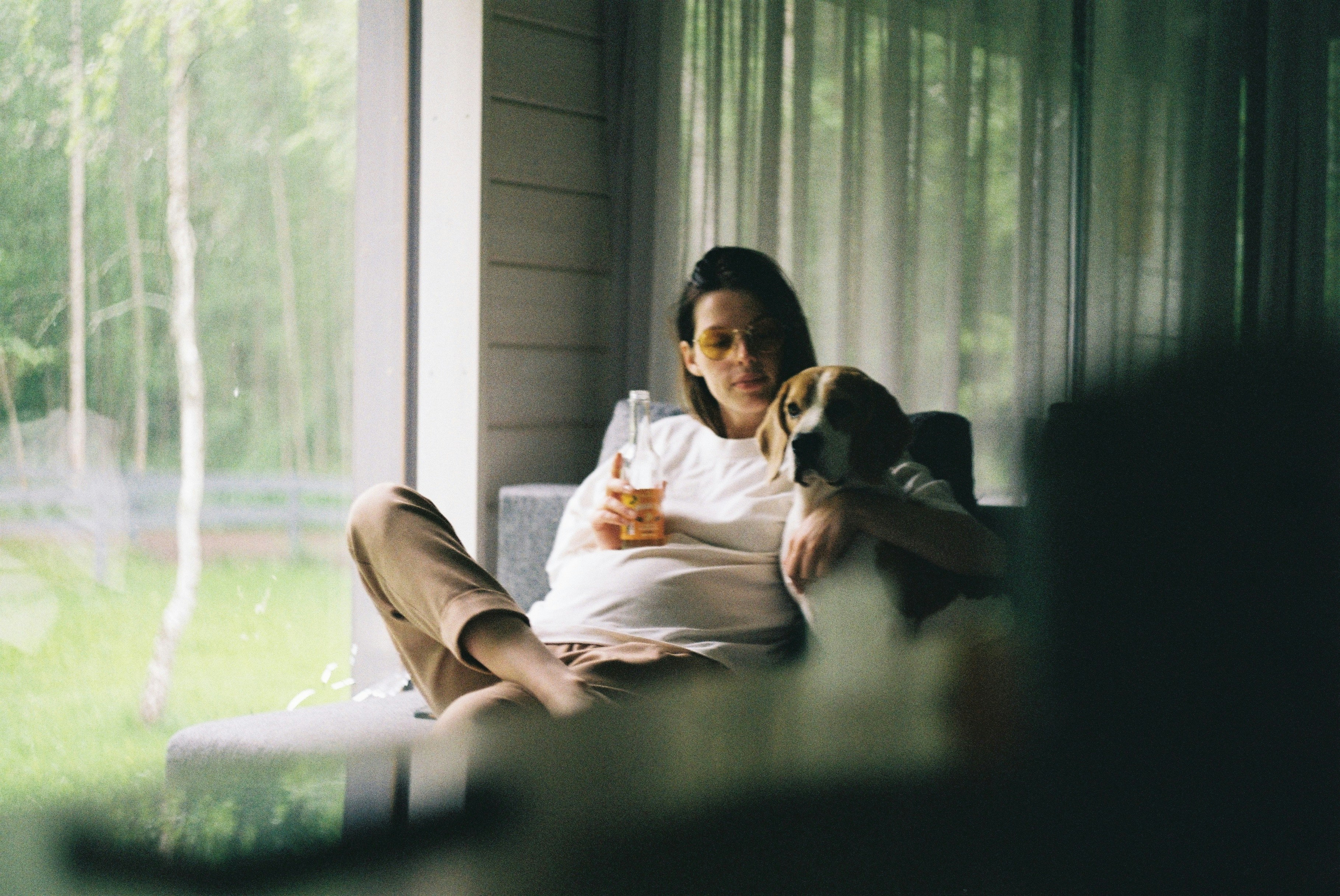 man in white robe sitting on couch