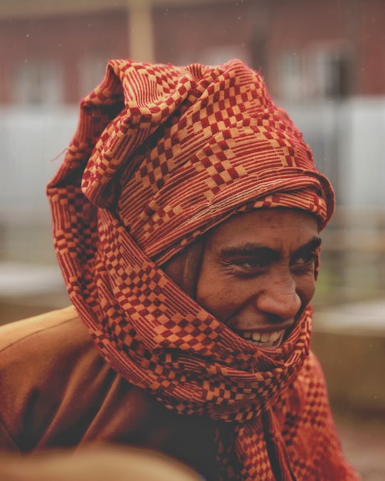 man in red and white hijab in Waliso Ethiopia