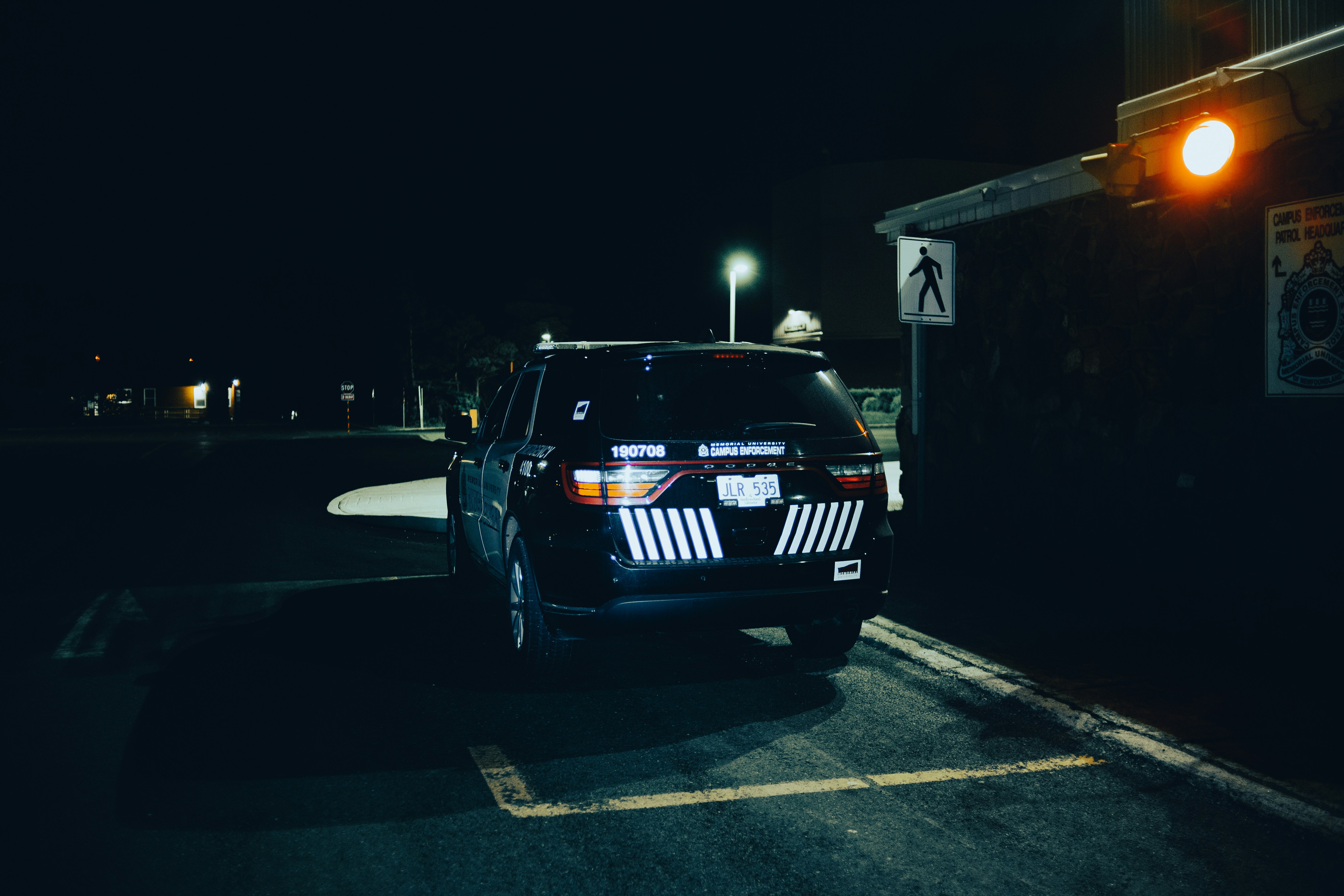 black bmw m 3 parked on parking lot during night time