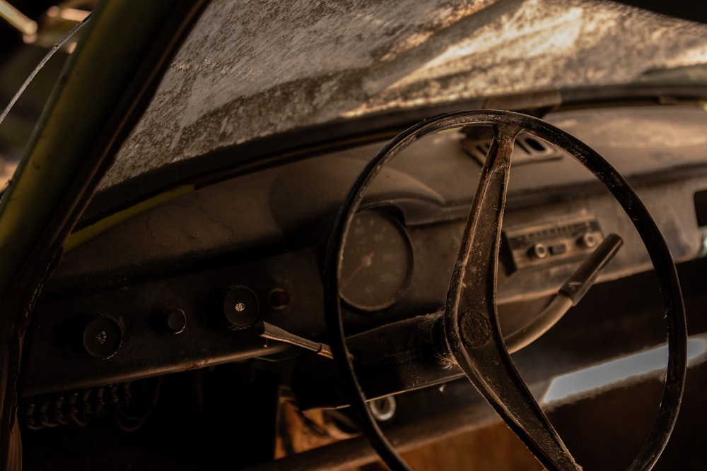 black steering wheel in close up photography