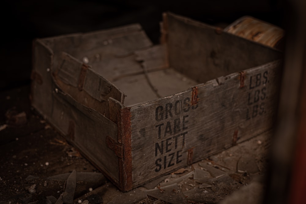 brown wooden crate on brown sand