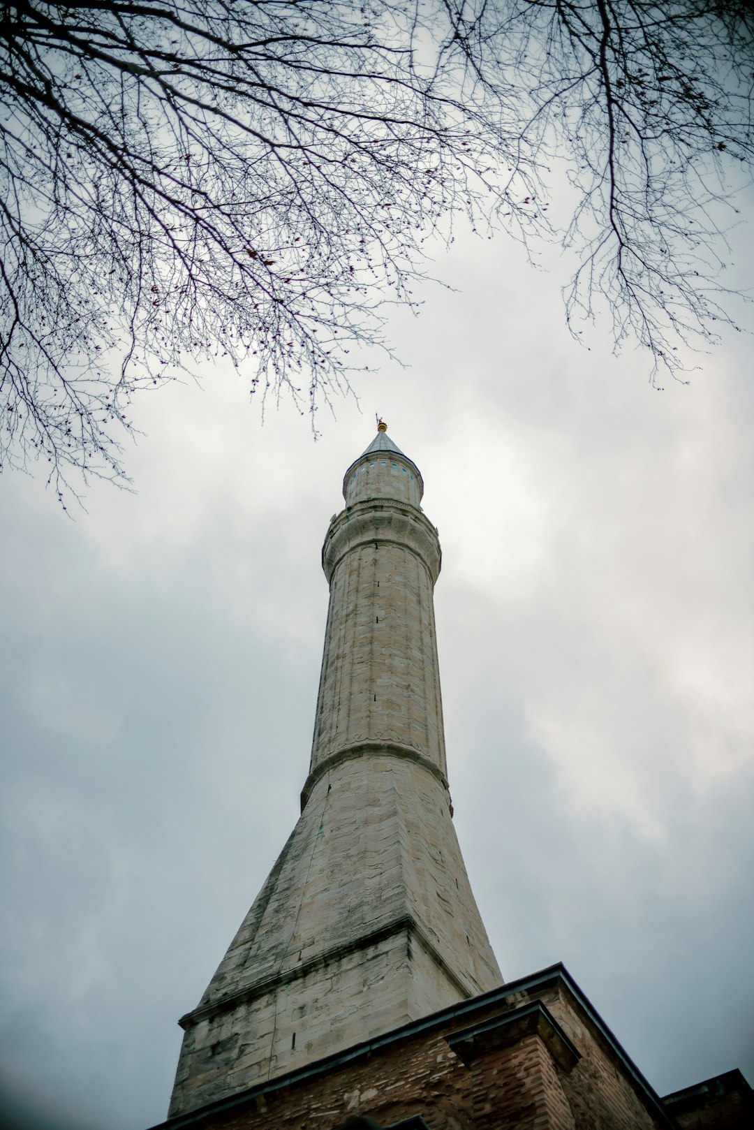 low angle photography of gray concrete tower