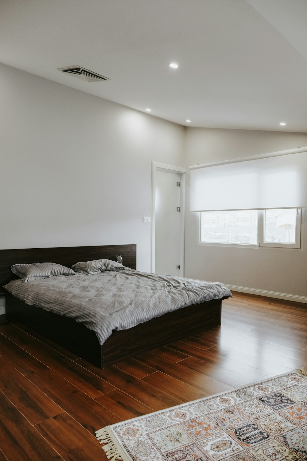 white bed linen on bed